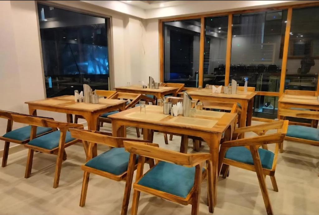 Elegant dining area with teak furniture at night